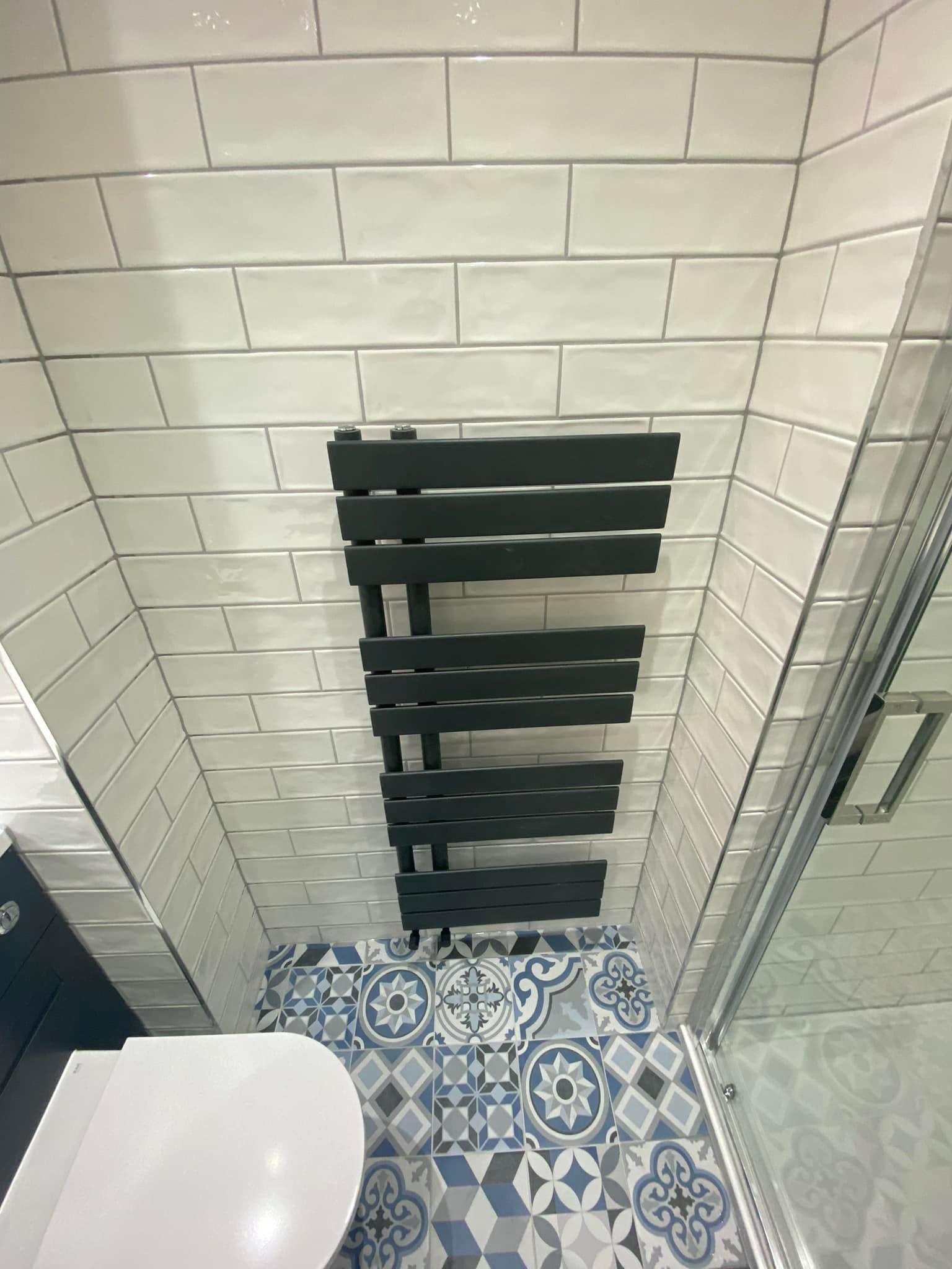 Dark radiator in bathroom